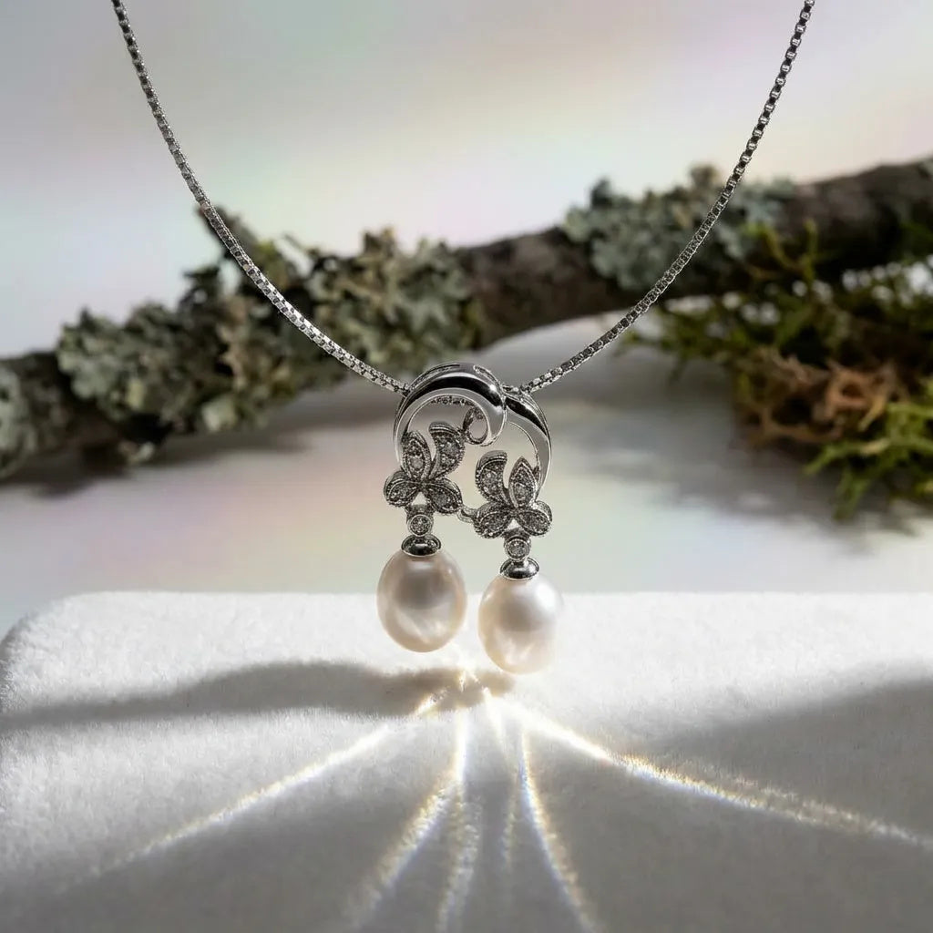 Dangling pearls and CZ with 925 sterling silver. Earrings and pendant set
