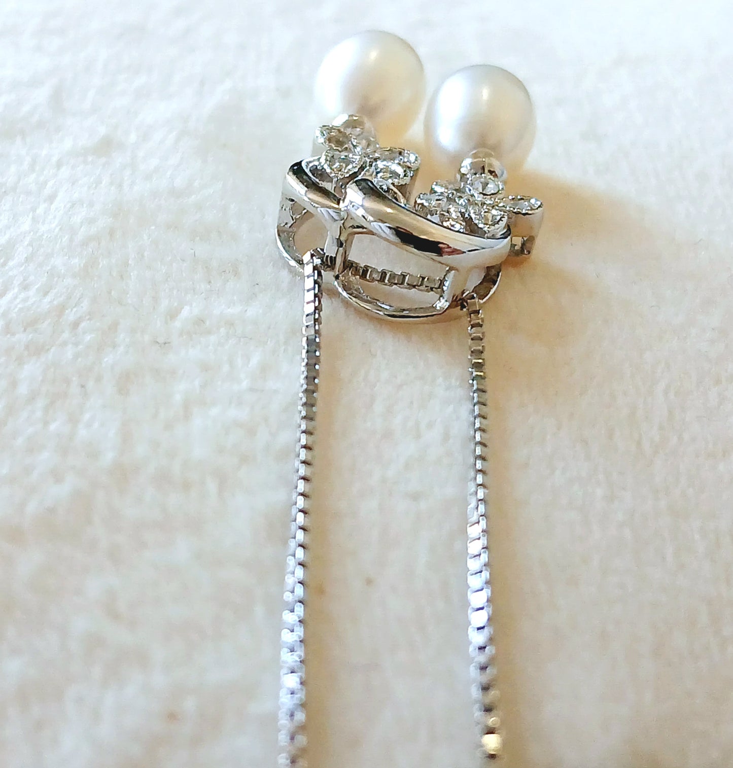 Dangling pearls and CZ with 925 sterling silver. Earrings and pendant set